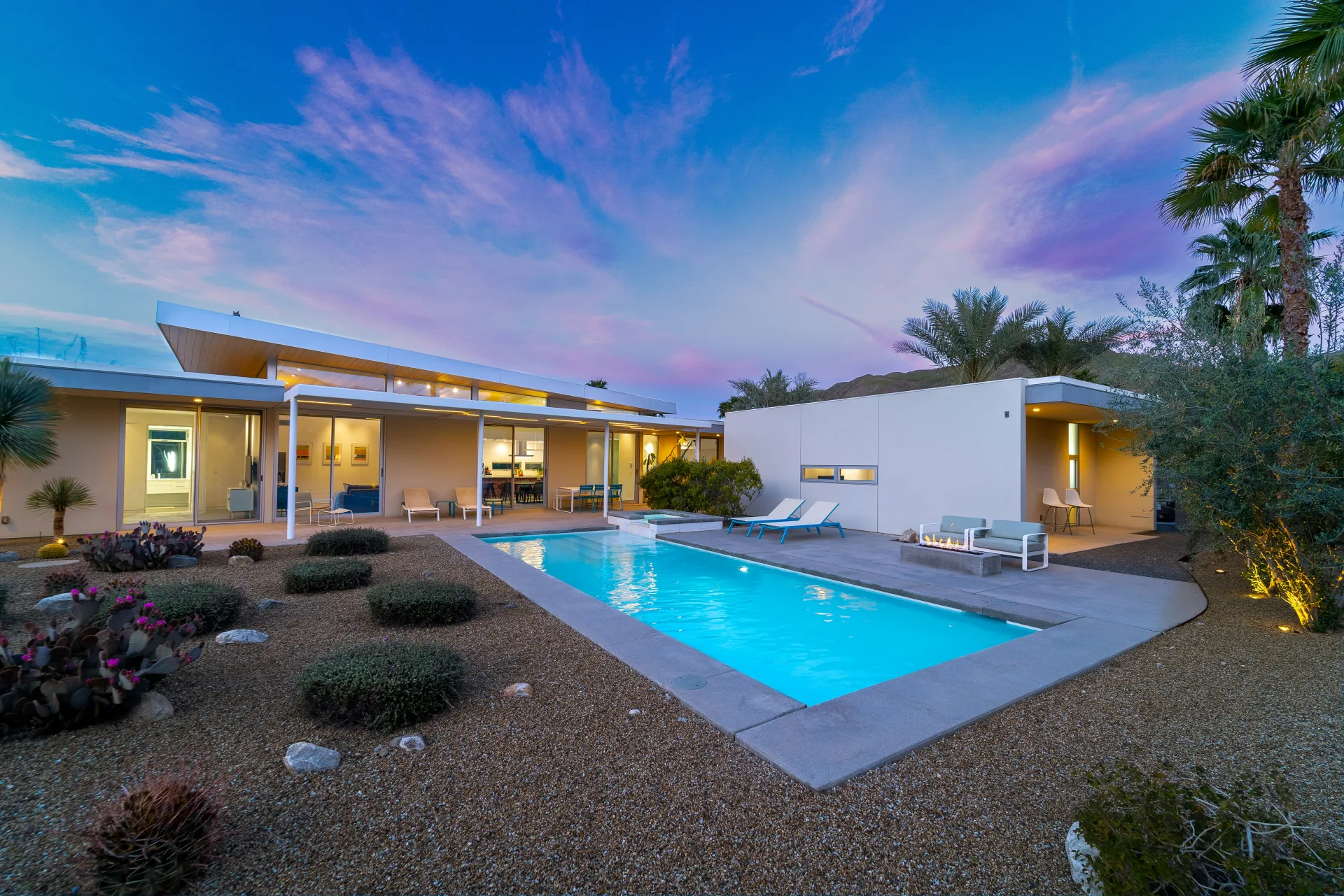 Pink and lavender dusk sky over a modern Tucson pool