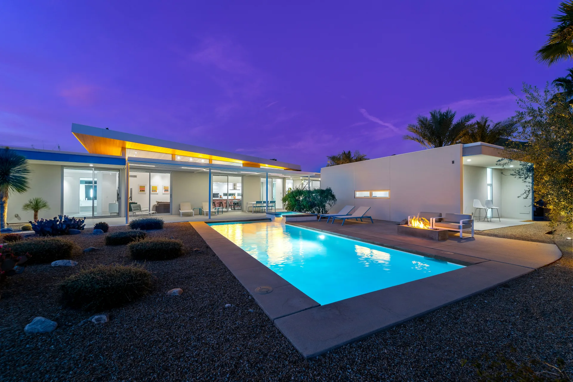 Purple twilight over a Tucson backyard with fire pit and pool
